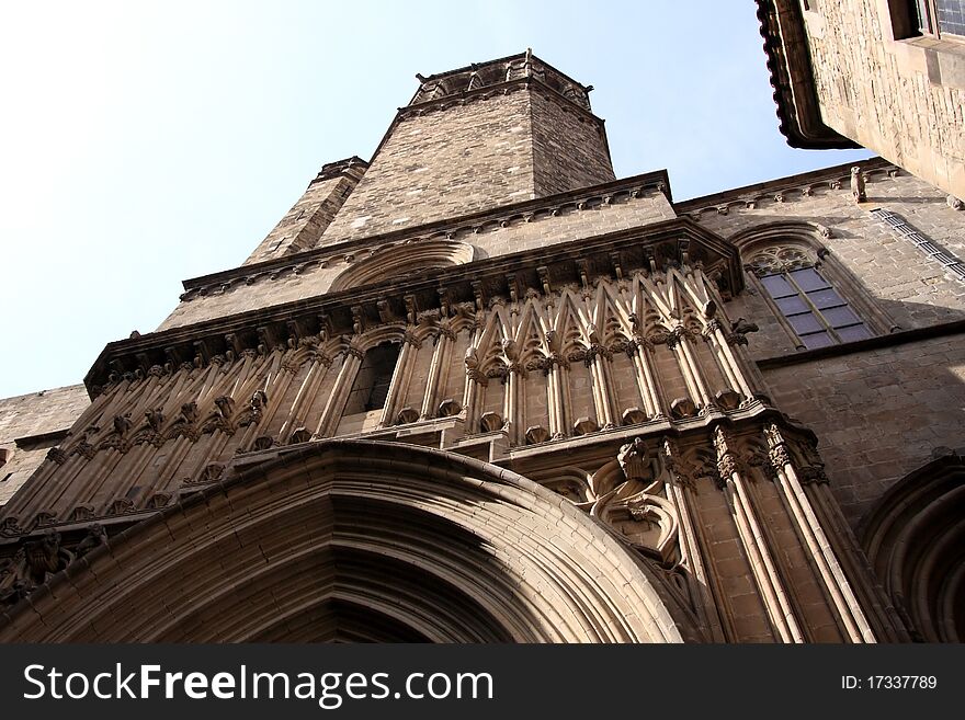 Fragment of a facade of a Gothic cathedral On Barcelonian street, Catalonia, Spain. Fragment of a facade of a Gothic cathedral On Barcelonian street, Catalonia, Spain.