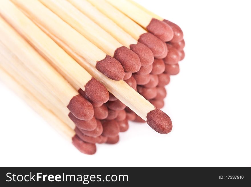 Macro of bunch of matches across white