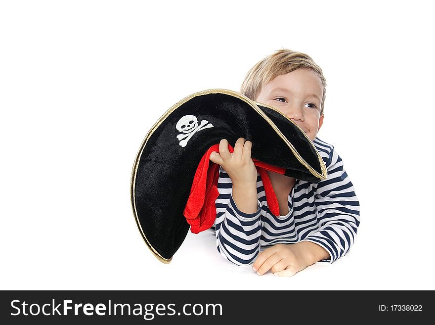 Young boy dressed as pirate over white