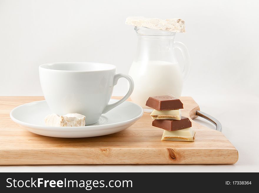 Breakfast with milk and chocolate on a white background