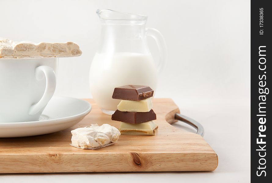 Breakfast with milk and chocolate on a white background