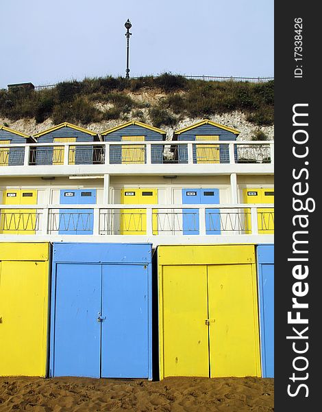 Cheery seaside beach huts on seafront at Broadstairs. Cheery seaside beach huts on seafront at Broadstairs