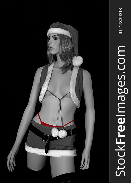 Image in black and white with a touch of red of a woman dressed as Santa Claus