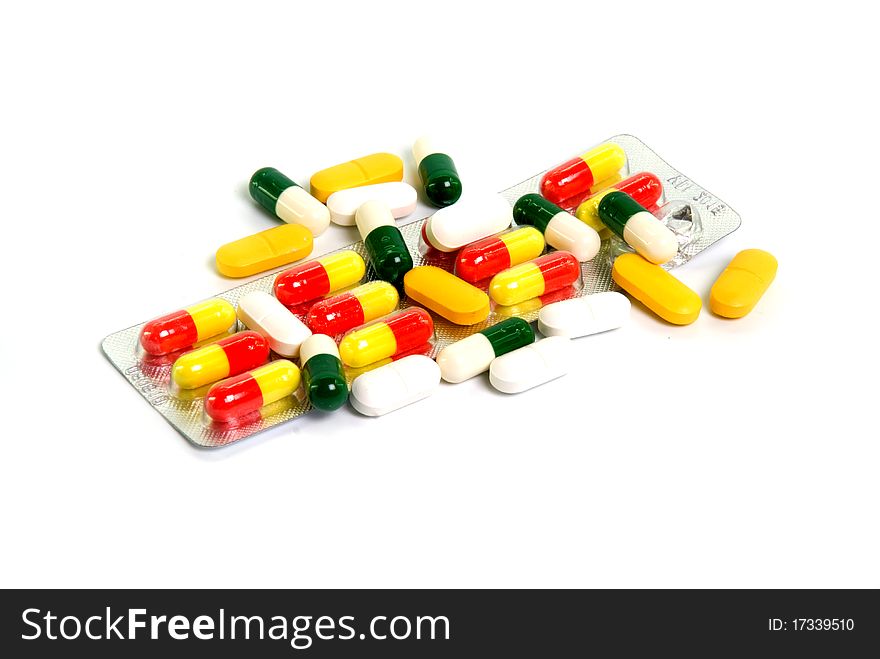 Different capsules on white background
