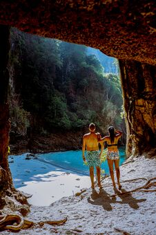 Hidden Beach With Huge Cave Near Koh Poda Island Krabi Thailand,men At A Limestone Cliff Looking Out Over The Secret Royalty Free Stock Images