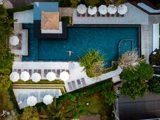 Top View Swimming Pool, Drone View Pool, Couple In Swimming Pool During Vacation Royalty Free Stock Photos