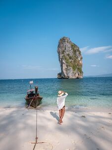 Koh Poda Krabi Thailand, White Beach With Crystal Clear Water In Krabi Thailand, Woman With Hat On The Beach Royalty Free Stock Images