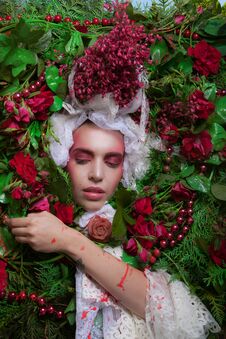 Female Portrait In Fairy Tale Stylization Surrounded With Natural Flowers. Royalty Free Stock Photos