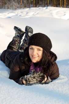 Happy Young Woman Laying In The Snow Royalty Free Stock Image Happy Young Woman Laying In The Snow Royalty Free Stock Image