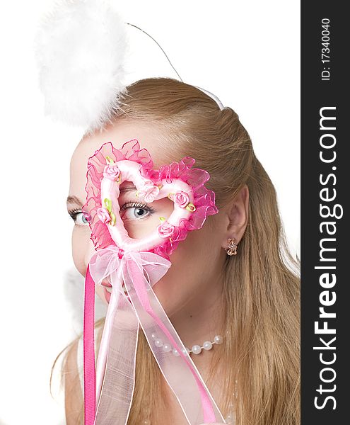 Blond girl in a valentine fancy dress on a white background