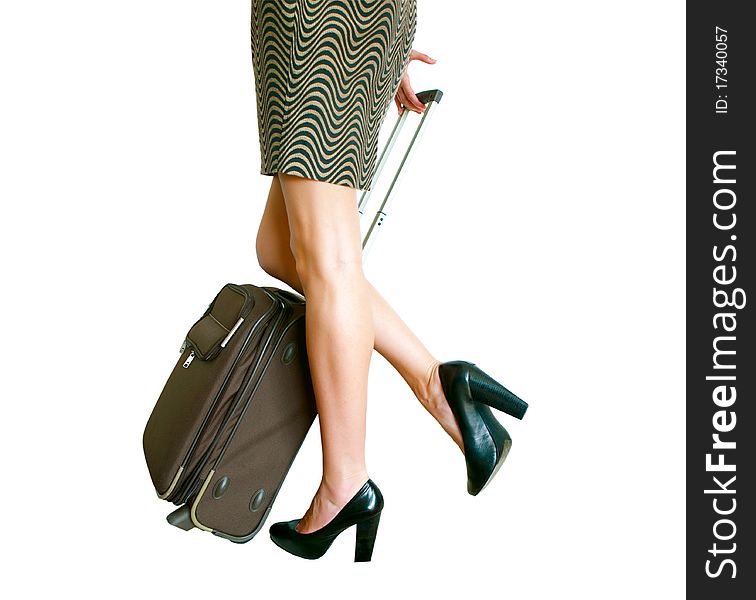 Woman's legs with suitcase isolated