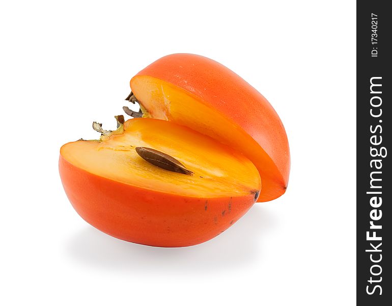 Persimmon cut into two parts, on a white background
