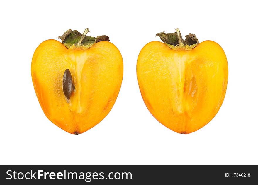 Persimmon cut into two parts. isolated on a white background