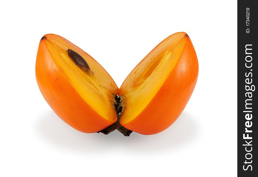 Persimmon cut into two parts, on a white background