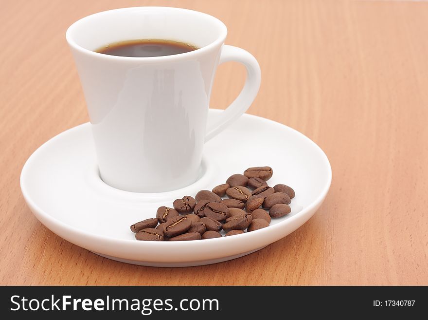 Coffee cup and grain on the table