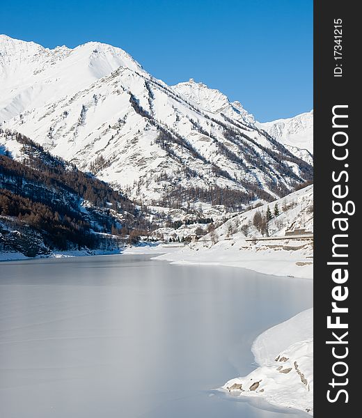 Frosty lake in the north of Italy during a sunny day.