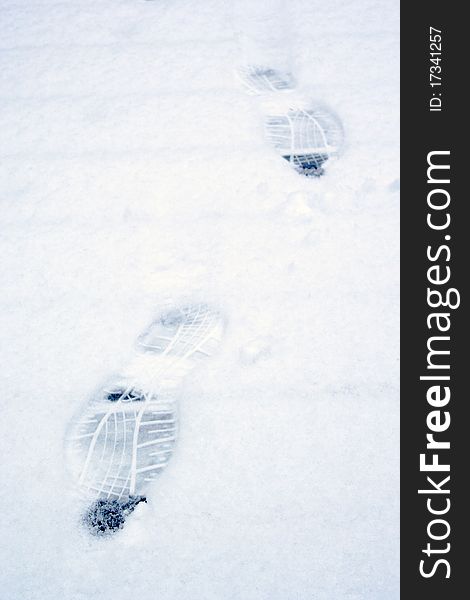 Footsteps in freshly fallen snow in early winter. Footsteps in freshly fallen snow in early winter
