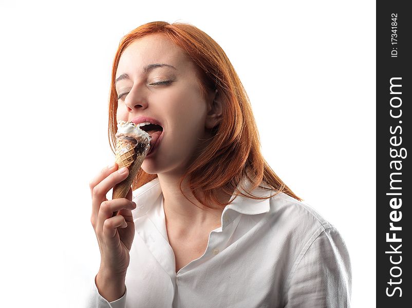 Young woman licking an ice cone