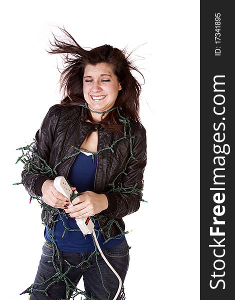 A woman feeling the full force of the Christmas season while she is wrapped up in Christmas lights getting shocked. A woman feeling the full force of the Christmas season while she is wrapped up in Christmas lights getting shocked.