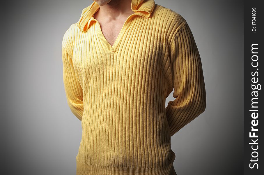 Closeup of a man's chest wearing a sweatshirt