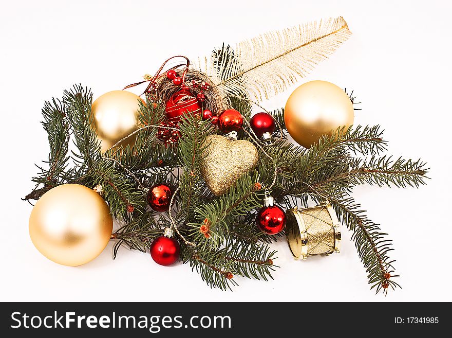 Gold Christmas baubles and Christmas tree branch