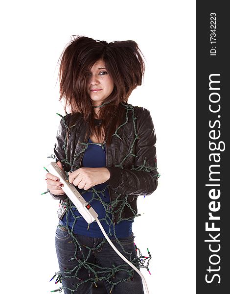 A woman all tied up in Christmas lights with a scared expression on her face and her hair standing up on end. A woman all tied up in Christmas lights with a scared expression on her face and her hair standing up on end.
