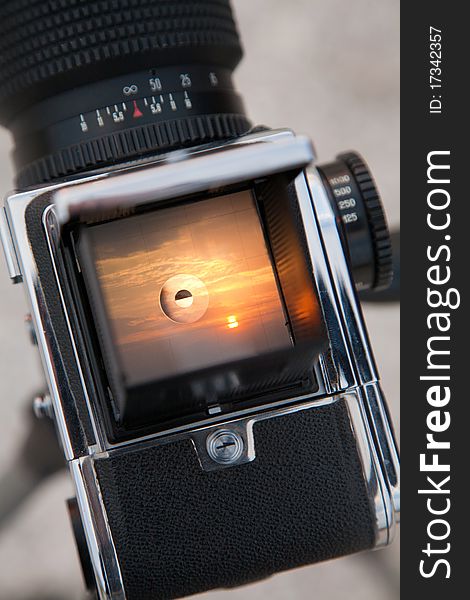 Sunrise through the viewfinder of a medium format camera