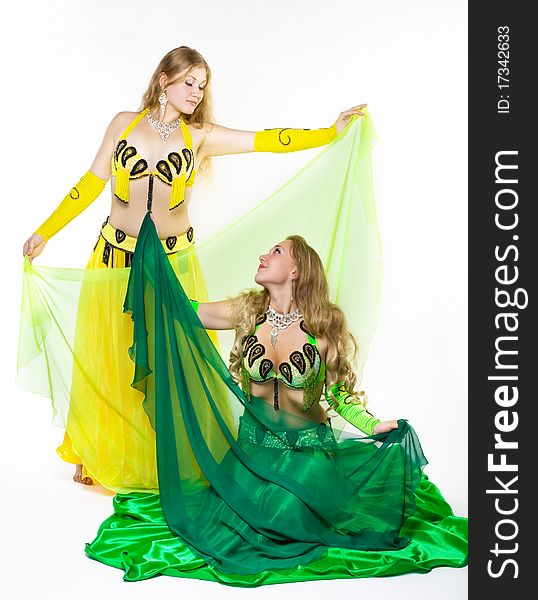 Two young girl dance with green veil - traditional arabic costume. Two young girl dance with green veil - traditional arabic costume