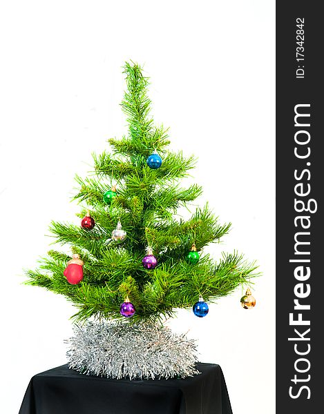 Image of Christmas fir tree decorated with color toy balls