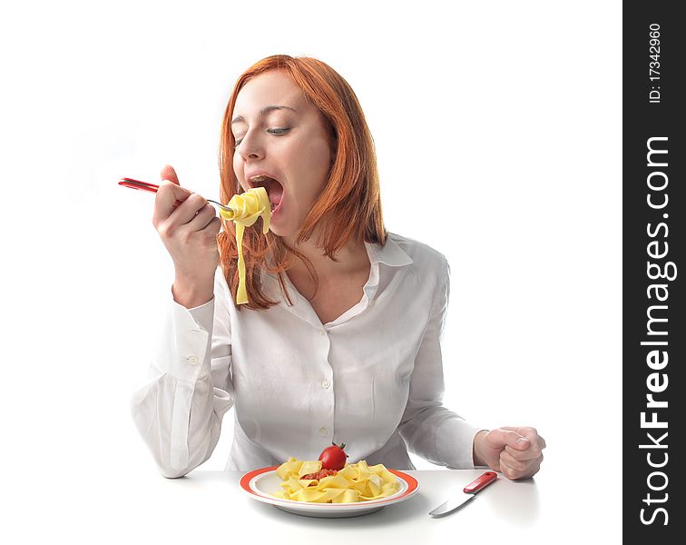 Young woman eating tagliatelle with tomato sauce. Young woman eating tagliatelle with tomato sauce
