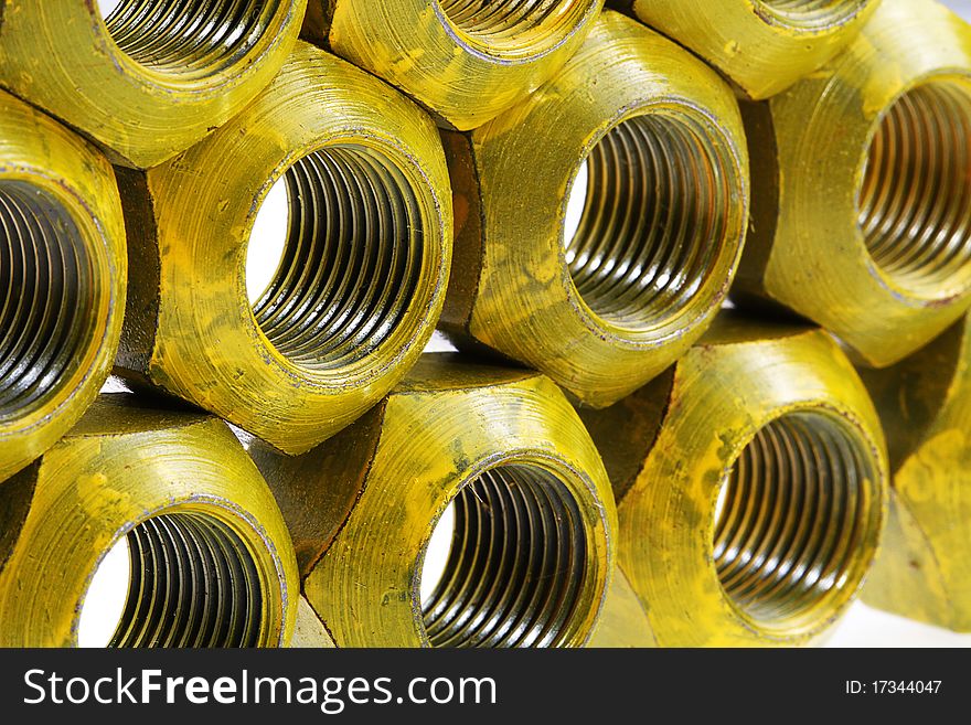 Lugnuts from a racecar wheel on a white background in a studio setting