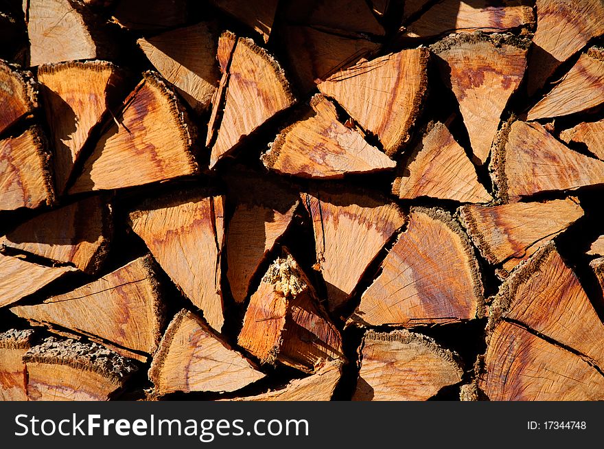 Stacked logs background with triangle shape