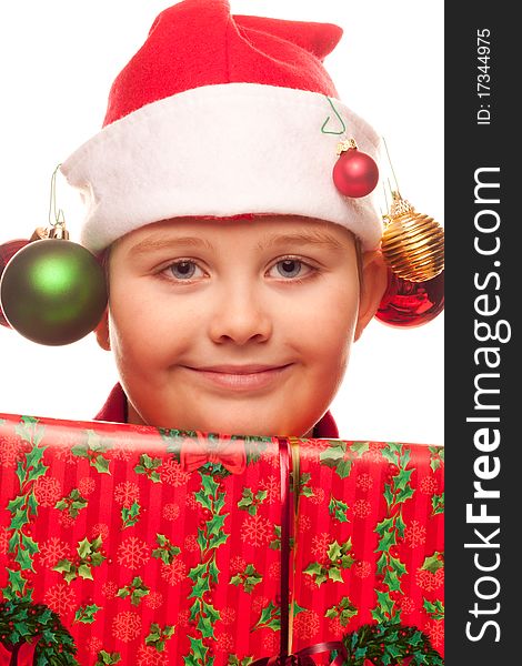 Christmas boy with a santa hat and ornaments. Christmas boy with a santa hat and ornaments