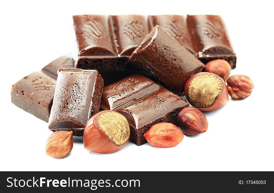 Hot chocolate with hazelnuts on a white background. Hot chocolate with hazelnuts on a white background