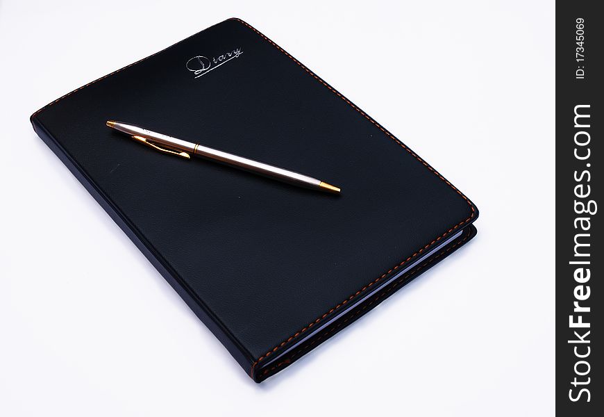 Opened book, diary and pen with blank pages isolated over white background