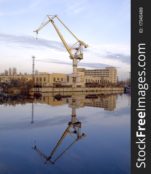 Reflection of the ship crane in water