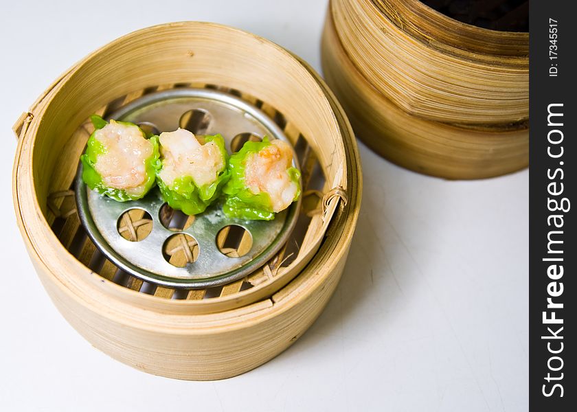 Chinese steamed dimsum in bamboo containers traditional cuisine. Chinese steamed dimsum in bamboo containers traditional cuisine