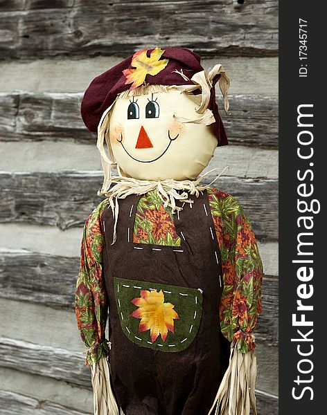 A cute smiling scarecrow, vertical with copy space. A cute smiling scarecrow, vertical with copy space