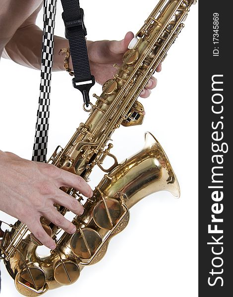 Shirtless jazzman plays a saxophone