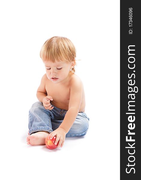 Little boy with an apple on a white background