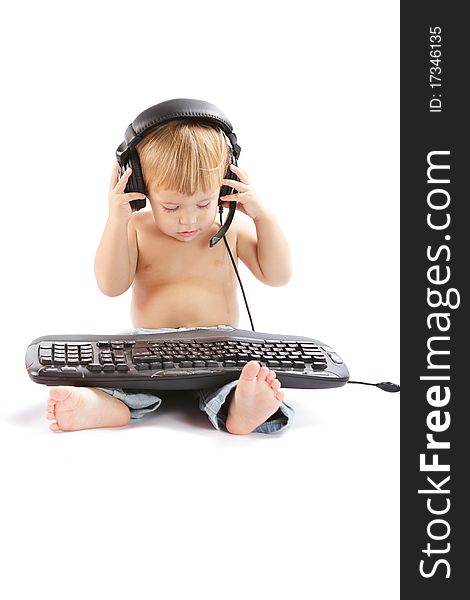 Little boy with headphones and keyboard. Little boy with headphones and keyboard