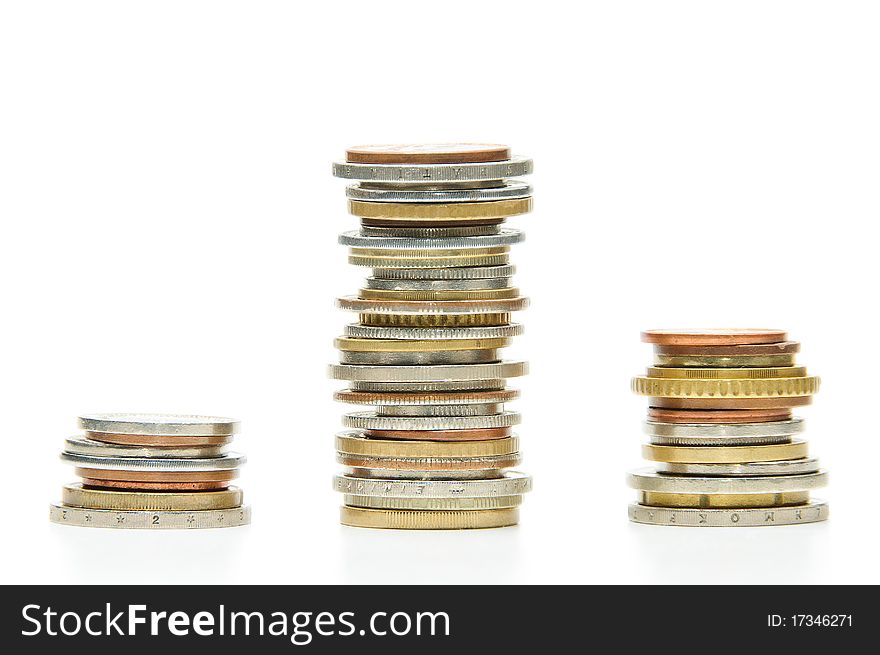 Three stacks of coins on white background