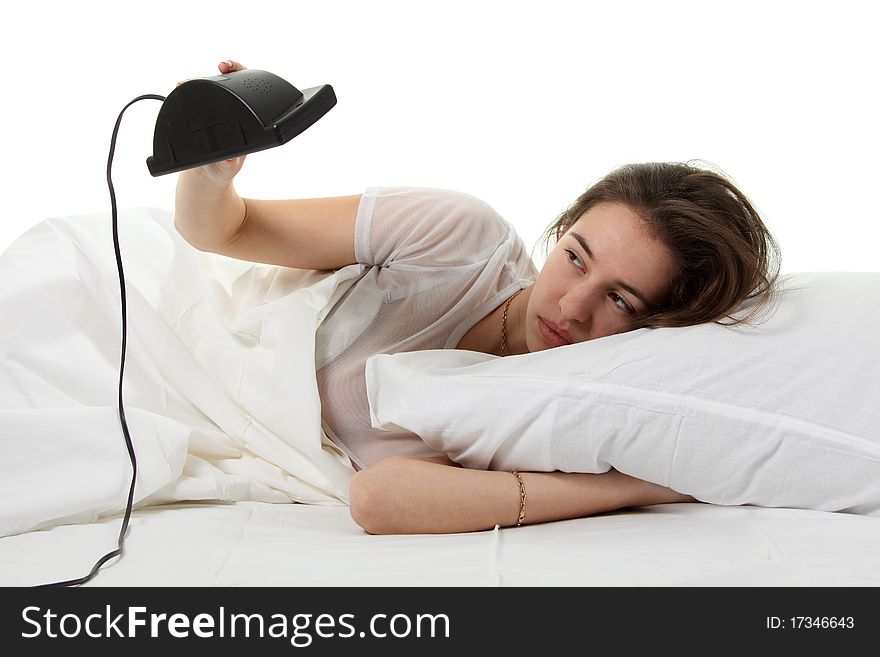 Woman In A Bed With Alarm Clock