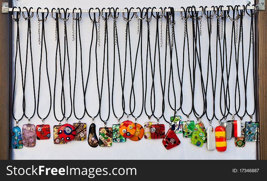 Lots of colorful medallions for sale at a fair. Lots of colorful medallions for sale at a fair