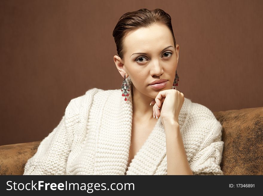 beautiful woman sitting on the sofa. beautiful woman sitting on the sofa