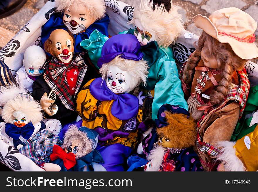 Lots of colorful puppets and toys representing circus clowns. Lots of colorful puppets and toys representing circus clowns