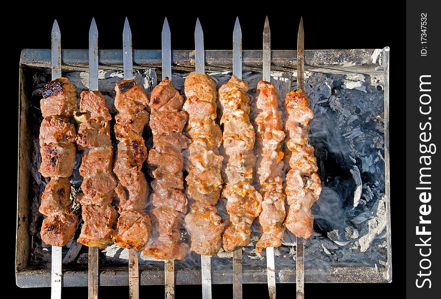 Shashlik (shish kebab) - traditional georgian barbecue prepared on a vine wood coal. Clipping path.