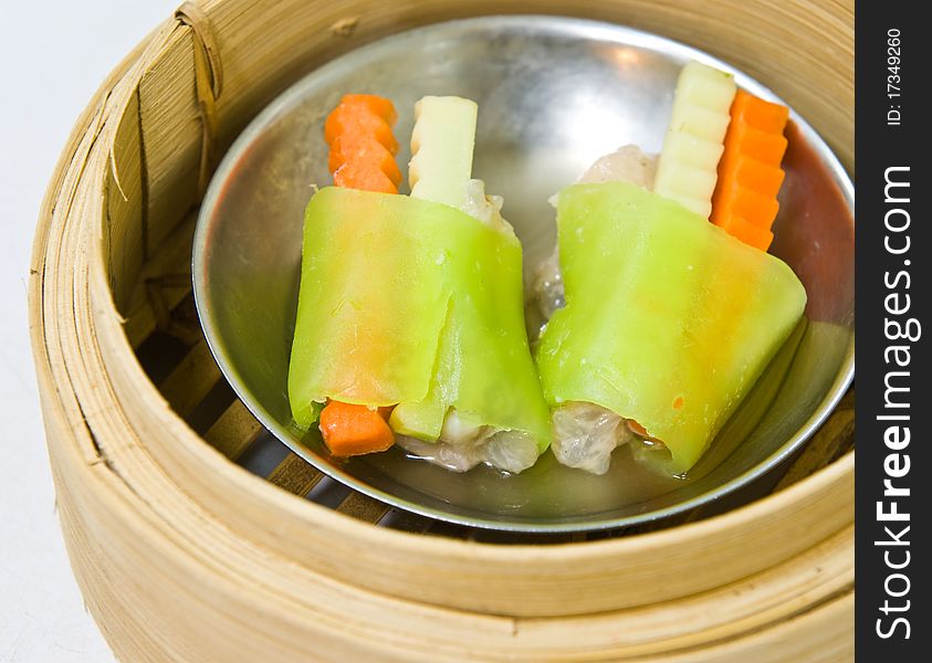 Chinese steamed dimsum in bamboo containers traditional cuisine. Chinese steamed dimsum in bamboo containers traditional cuisine