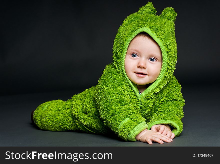 Baby in a frog outfit