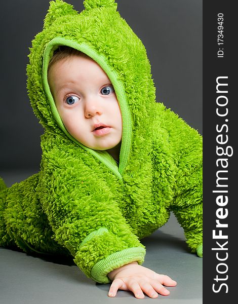 Baby in a frog outfit